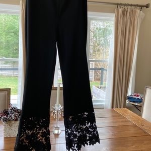 Stretch fit pants with boot cut lace